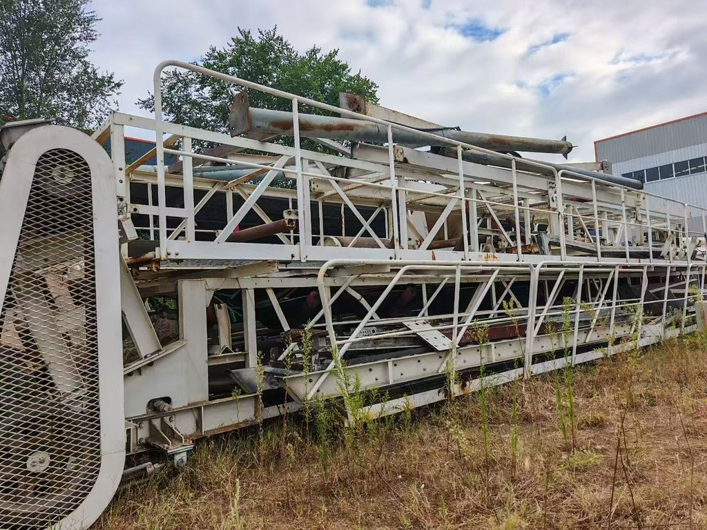Actual conveyor and walkway frame sections photographed laid down at the used SANY HZS180 plant site