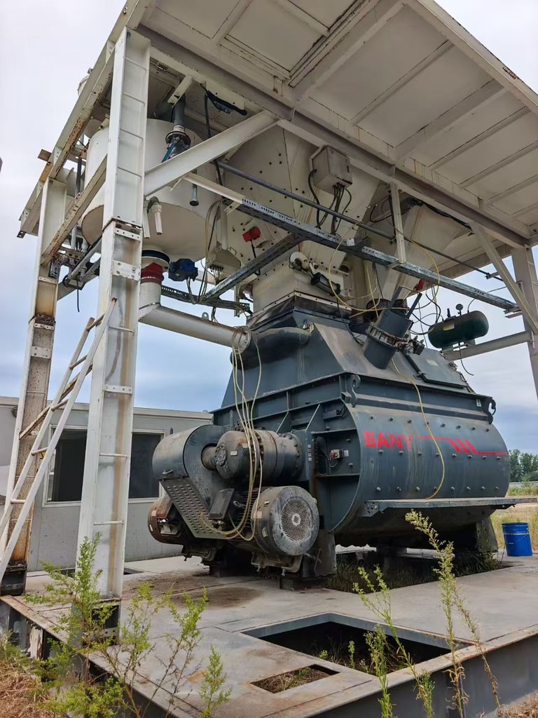 Actual SANY twin-shaft mixer unit and upper hopper inside the steel frame of used SANY HZS180 concrete batching plant PB-SANY-HZS180-001